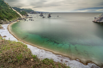 Playa del Silencio with clouds in Asturias, Spain. Long Exposure.