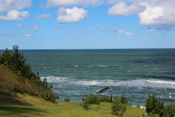 Beautiful view from the high shore to the sea, to the splashes, to the sea foam