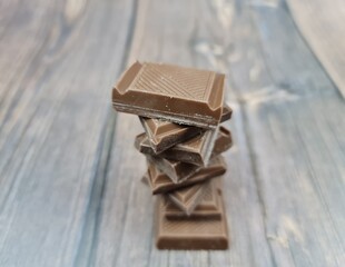 The Chocolate close-up. Pieces of natural chocolate. Milk chocolate.