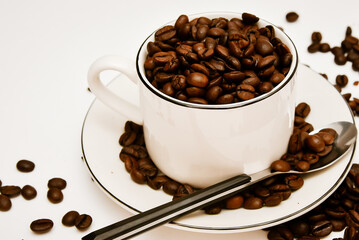Coffee background with beans and white cup. making coffee in pub, bar, restaurant