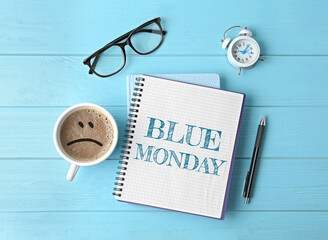 Blue Monday. Flat lay composition with office stationery and cup of coffee on wooden table