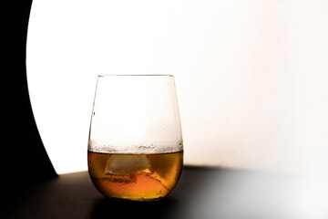 Glass of wiskey on white background.