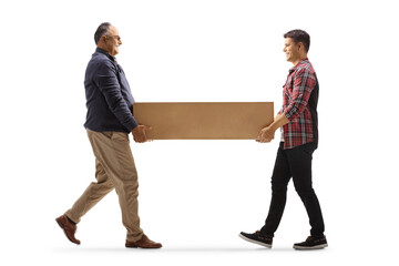 Father and son carrying a cardboard box