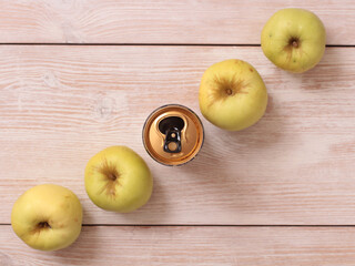 Big green apple on a kitchen scale on a wooden table
