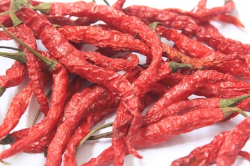 close up of a bunch of dried red chilies, top view