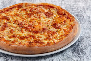 fresh pizza on the white plate