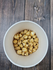 The Fresh hot natural popcorn close-up. Fresh caramel corn.