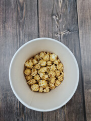 The Fresh hot natural popcorn close-up. Fresh caramel corn.