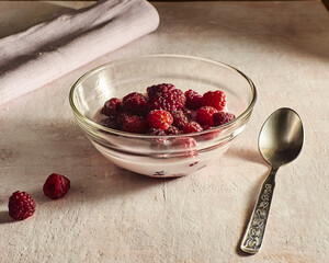 Healthy breakfast with raspberries and milk.