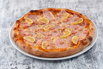 fresh pizza on the white plate