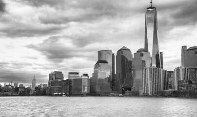 Downtown New York City at sunset from a moving ferry boat.