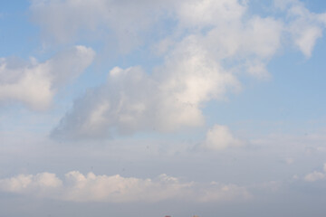 Sunny sky abstract background, beautiful cloudscape, on the heaven, view over white fluffy clouds, freedom concept