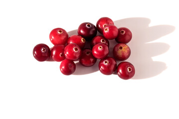 A handful of ripe healthy tasty cranberries on an isolated white background. 