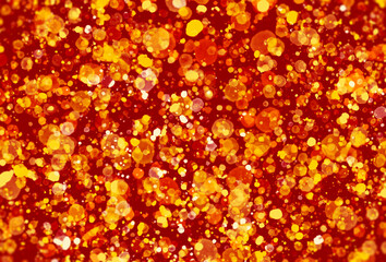 glitter gold particles on red background.