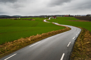 Countryside road slinging through the landscape in Norway