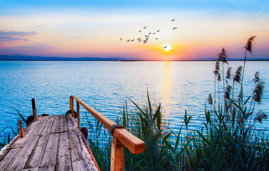 Naklejka na ściany i meble paisaje de un amanecer azul en el mar mediterraneo