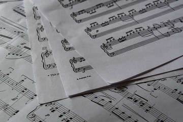 Sheet music and musical notation, beautiful works written on sheets of paper lying in disarray.