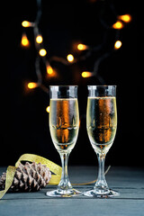 Two bubbly champagne glasses, celebration theme.