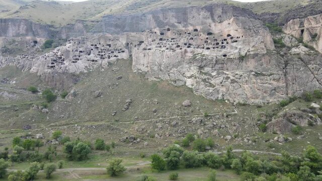 Aerial panoramic drone view of Vardzia ancient caves monastery in the Erusheti Mountain at Kura River in Georgia