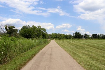 Fototapeta na wymiar The long straight walkway in the country park.