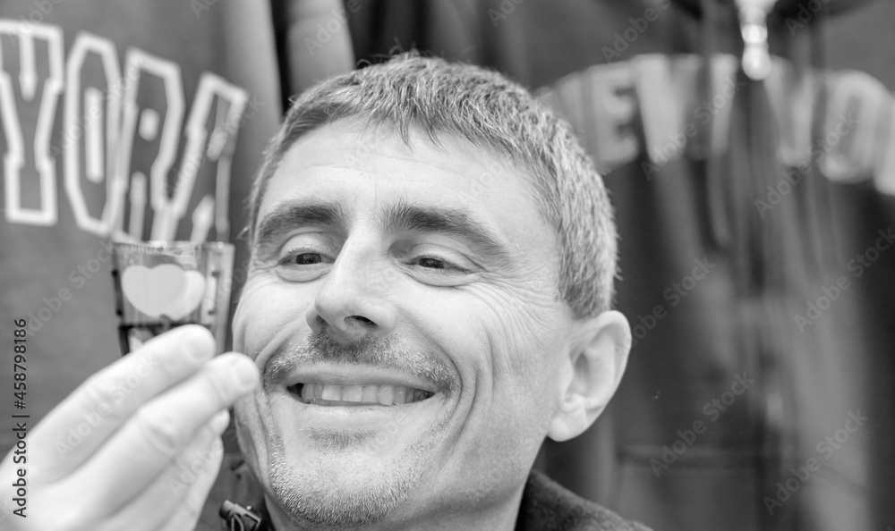 Canvas Prints Happy man touching New York City souvenirs.