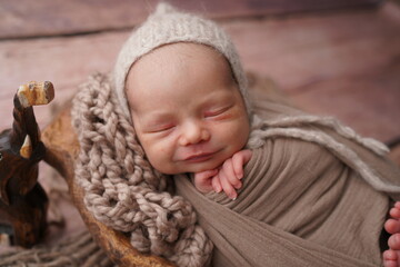 Sleeping newborn boy in the first days of life. Newborn photo session.