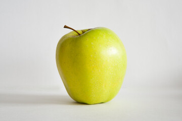 Green apple on a white background. Healthy eating, diet, lifestyle concept, treatment choice concept. High quality photo