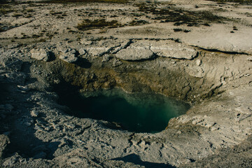 Geothermal pools with vibrant colors.