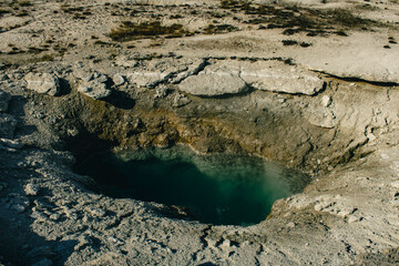 Geothermal pools with vibrant colors.