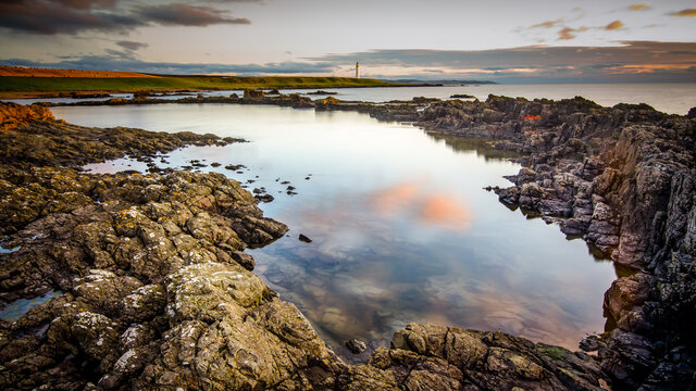 A view of Scurdie Ness lighthouse , Angus Scotland, at sunrise. From  Usan