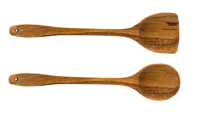 Two wooden spoons with holes on the handles isolated on a white background