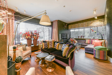 Bright and colorful living room with sofas and plants