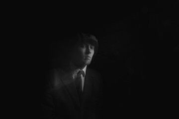 blurred portrait of a man in the dark