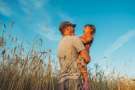 Father playing with his cute little daughter. Great family vacation.