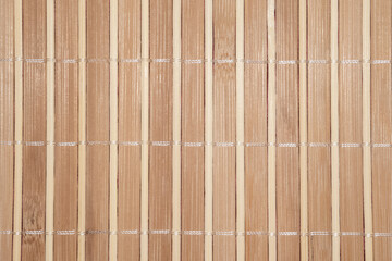 Close up textured weathered light bamboo backdrop with threads