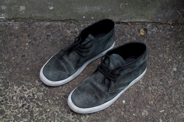 A pair of faded black shoes.