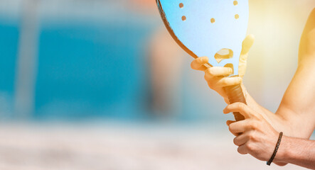 Man playing beach tennis on a beach. Horizontal sport poster, greeting cards, headers, website