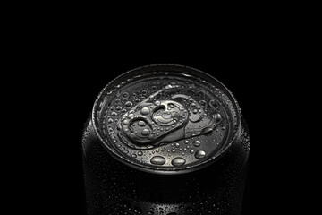top of the dark drink metal can on a black background. water splashes all around, concept of refreshment at summer, copy space