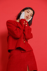 asian woman on red background in fashion shoot