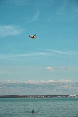 fire-fighting aircraft in action at the beach in zadar. High quality photo