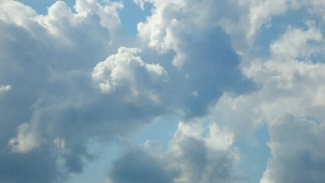 Blue sky white clouds. Puffy fluffy white clouds. Cumulus cloud cloudscape timelapse. Nature weather blue sky. White clouds background. Cloud timelapse nature background.