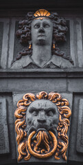 Sculptures of heads on the facade of the building