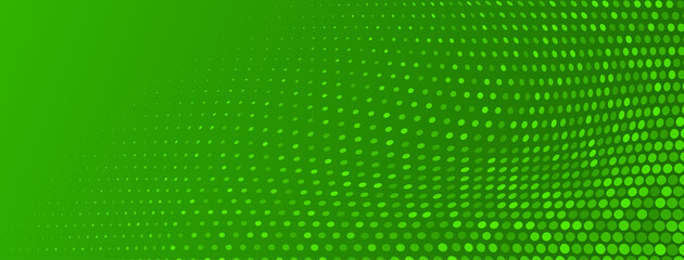 Abstract halftone background made of small round dots of different sizes in green colors