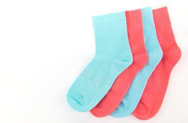 New socks on a white background. Colorful socks with beige label for your design. Isolated object