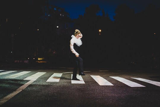 The girl with makeup of the mime. improvisation. Suit for Halloween. mime shows different emotions. Sad clown. Evening vibe.