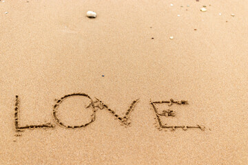 love lettering on the beach.