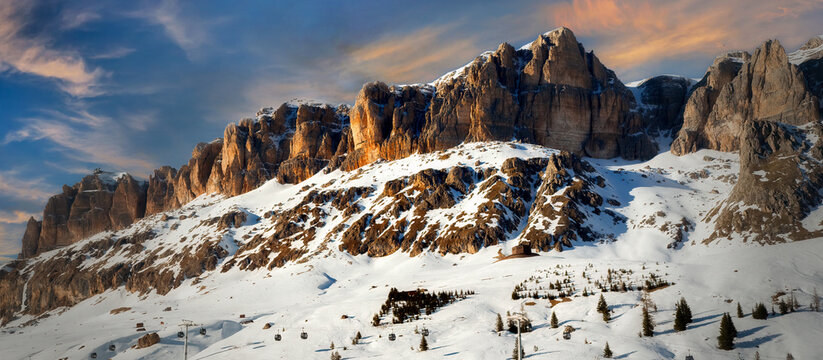 View of a ski resort piste by Passo Pordoi pass at sunset. Dolomites, Arabba, Italy