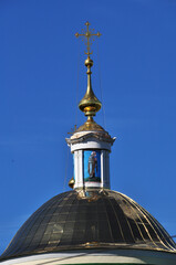 Icon on the roof of the church. Dome of the roof against the blue sky. September 03, 2021, Orel, Russia.