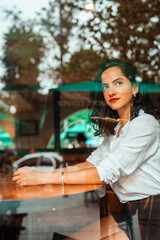 business girl looking through the window