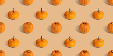 Pumpkin seamless pattern on beige background. Banner. Halloween pumpkin background. Autumn concept.